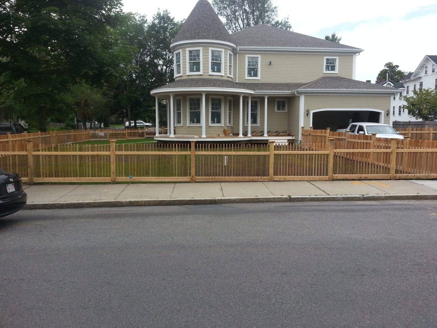 Wood Fence with a Luxury house