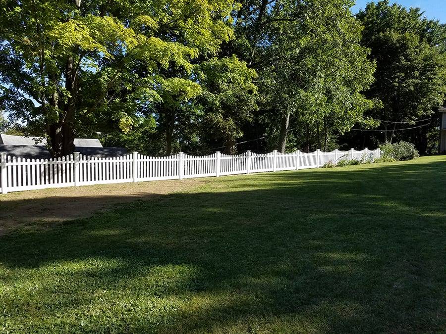 Landscape with a white picket fence